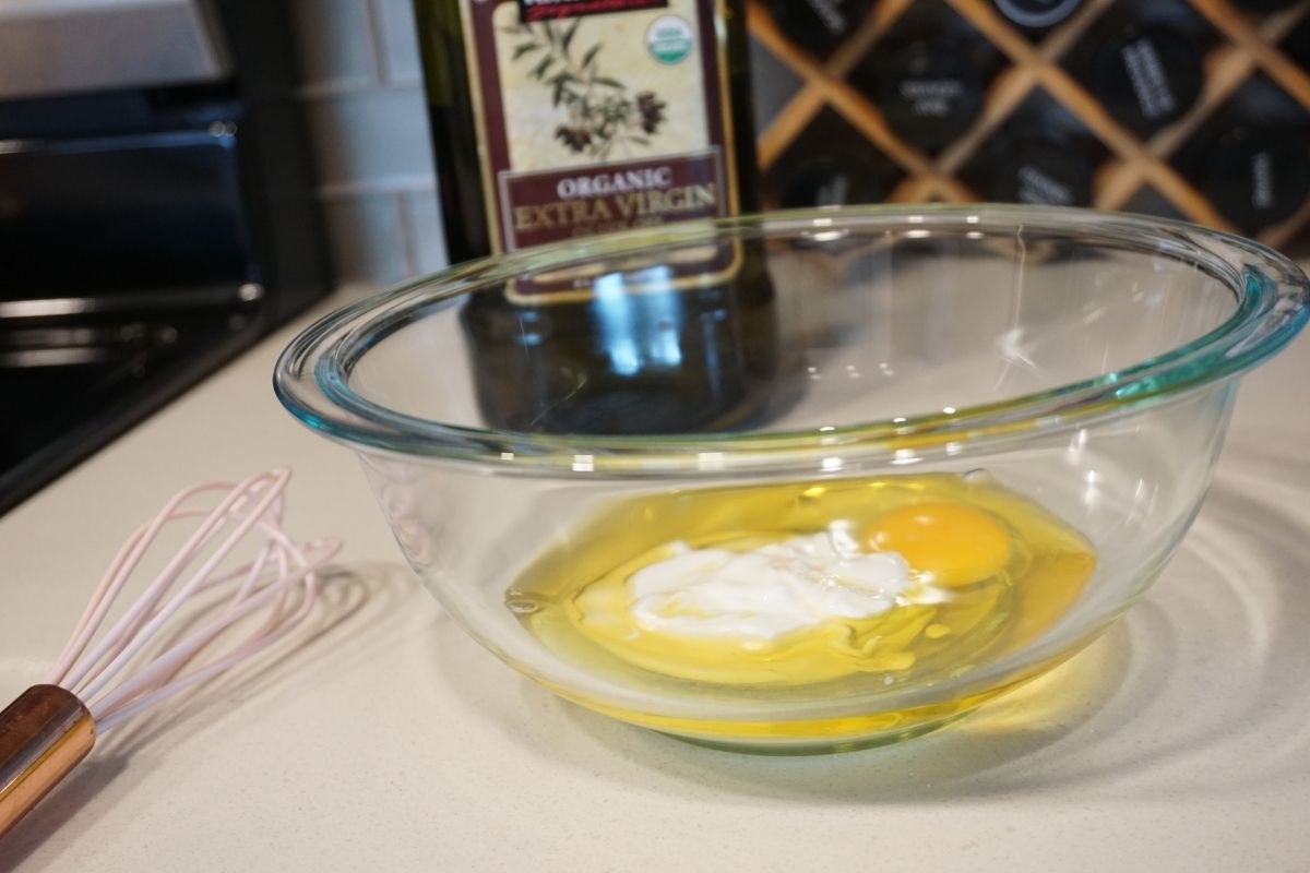 oil egg and yogurt in a bowl