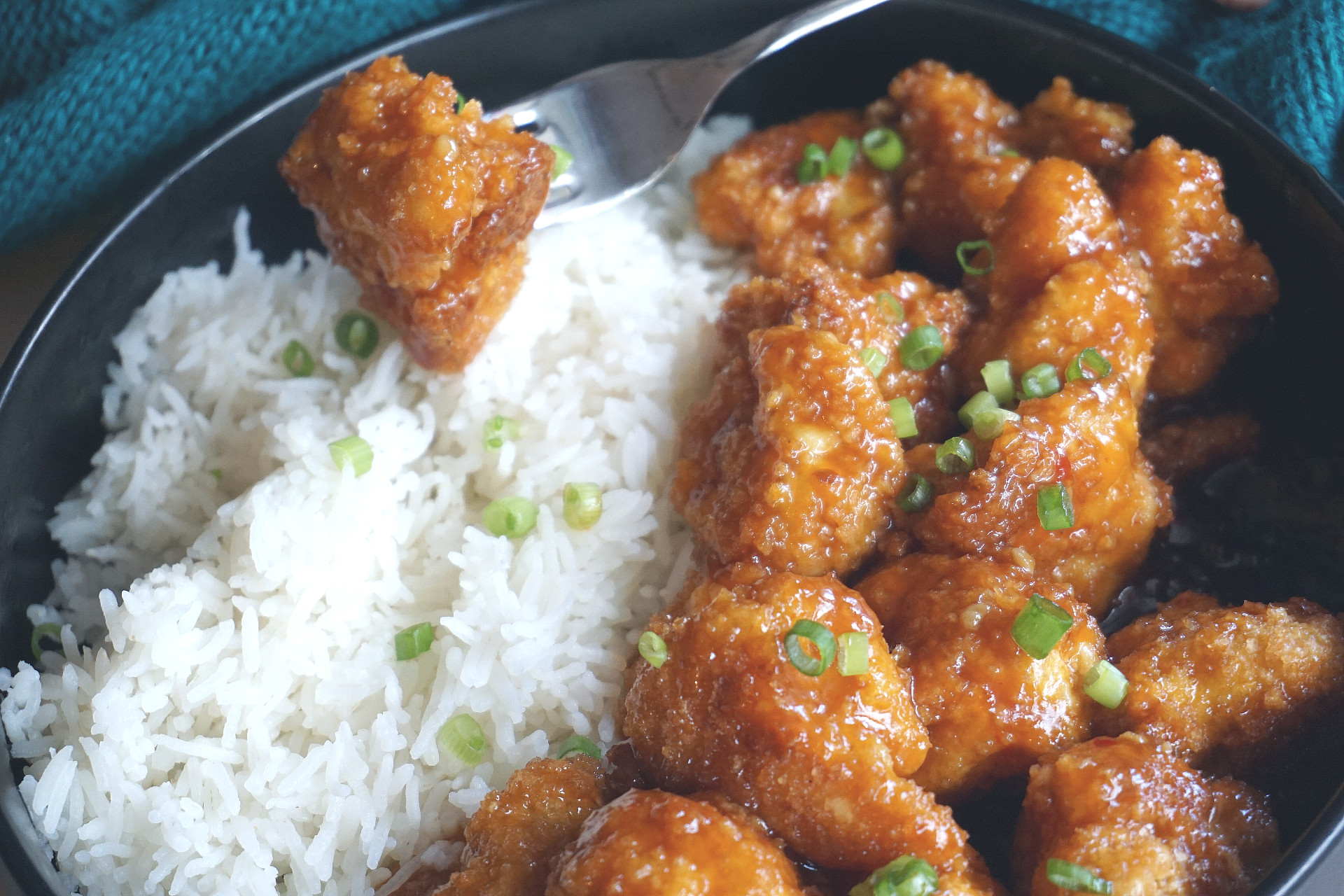 general tso cauliflower and rice in a bowl
