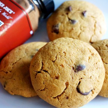 pumpkin cookies with spice bottle by side