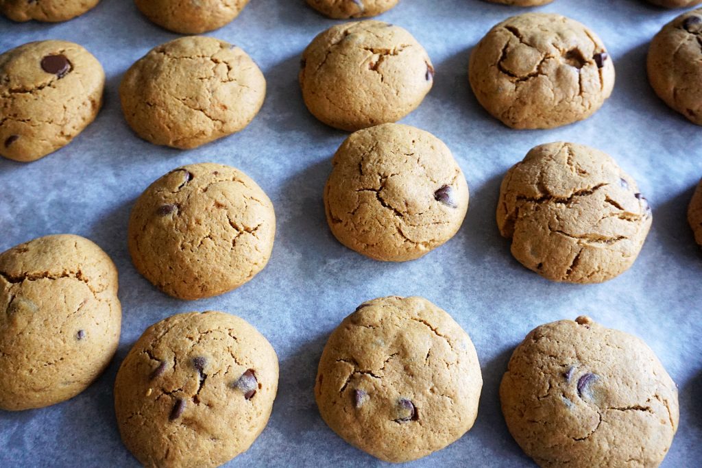 baked pumpkin cookies on parchment paper