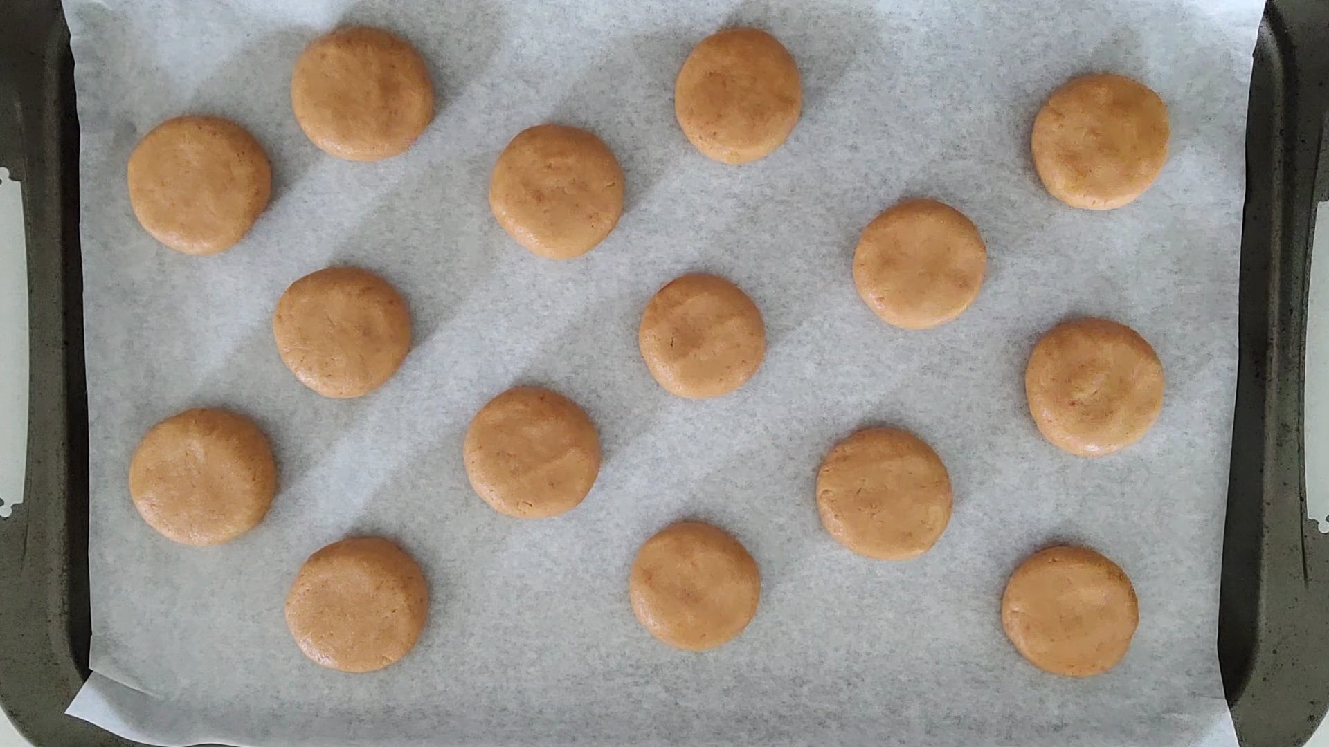 cookie dough rounds on baking sheet