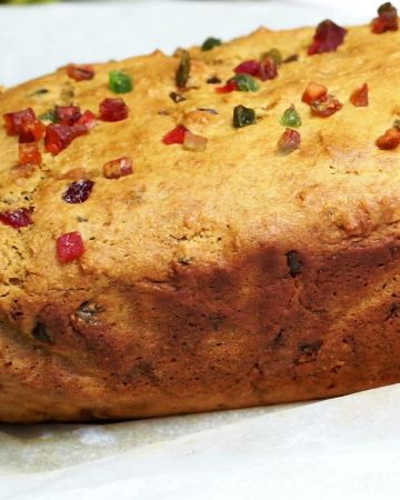 Tutti frutti cake on parchment paper.