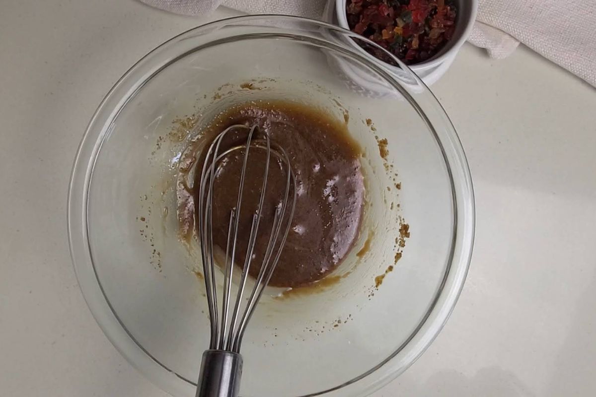 Melted butter and jaggery mixed in a bowl.