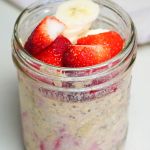 Overnight oats topped with banana and strawberries.
