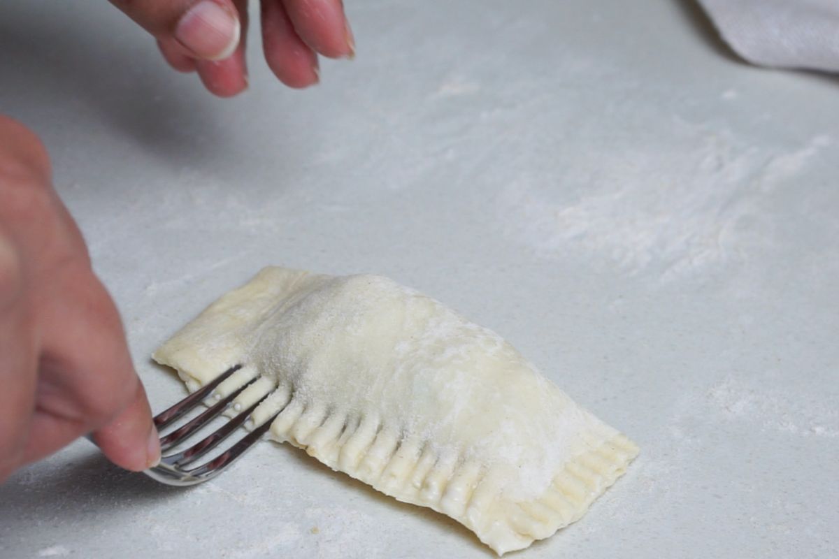 Design added on the sides of pastry using fork.