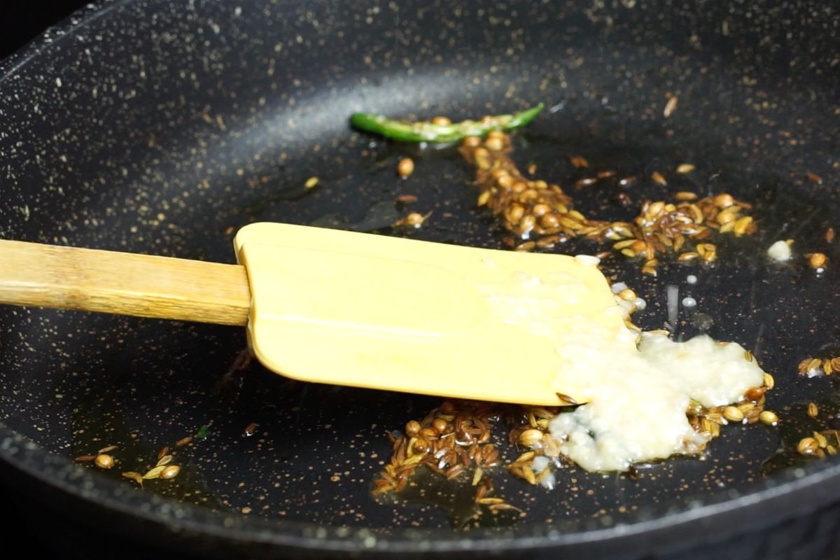 Ginger garlic paste added to the pan.