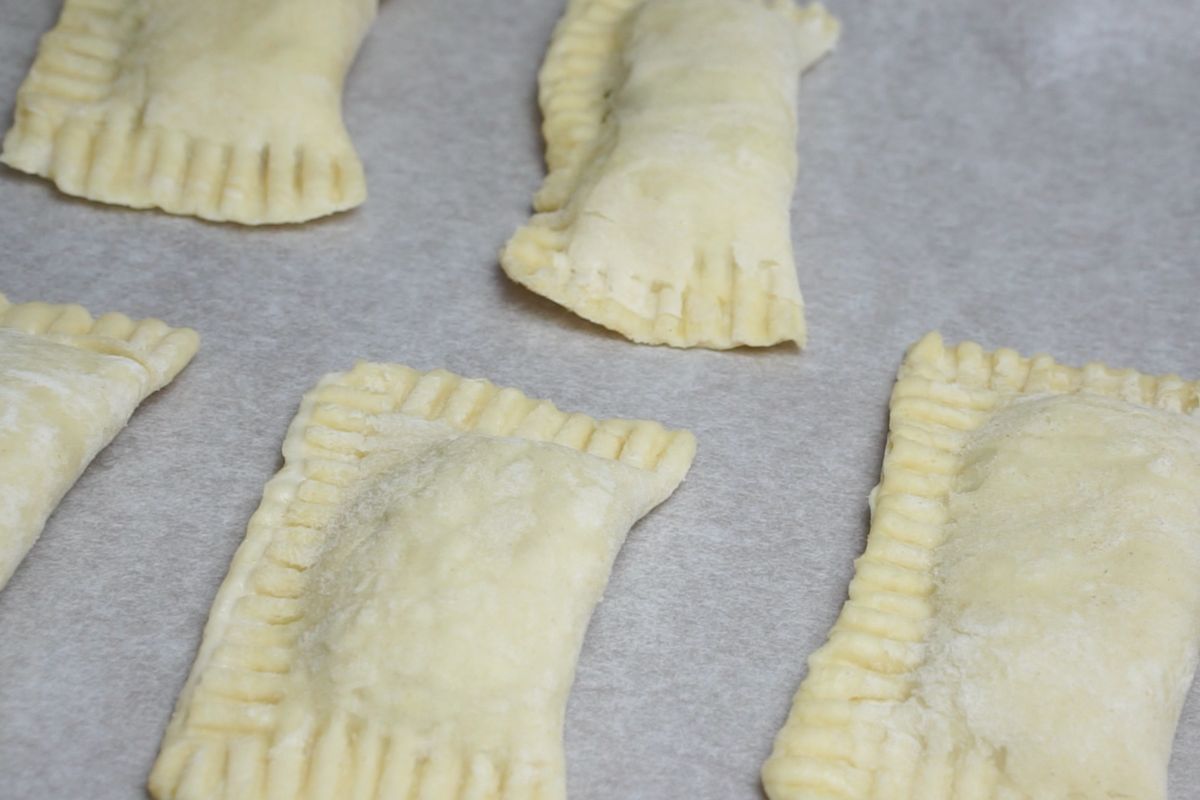 All pastry rectangles placed on a baking tray lined with parchment paper.