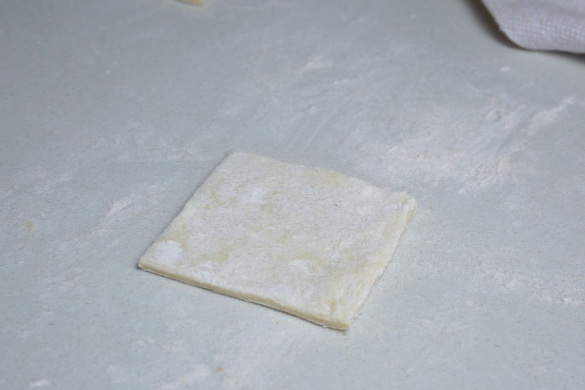 Pastry square dusted with flour.