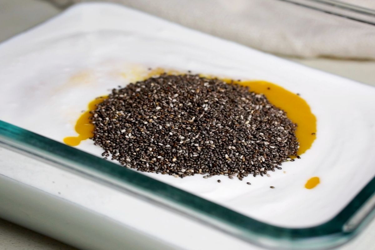 Chia seeds added to the bowl.